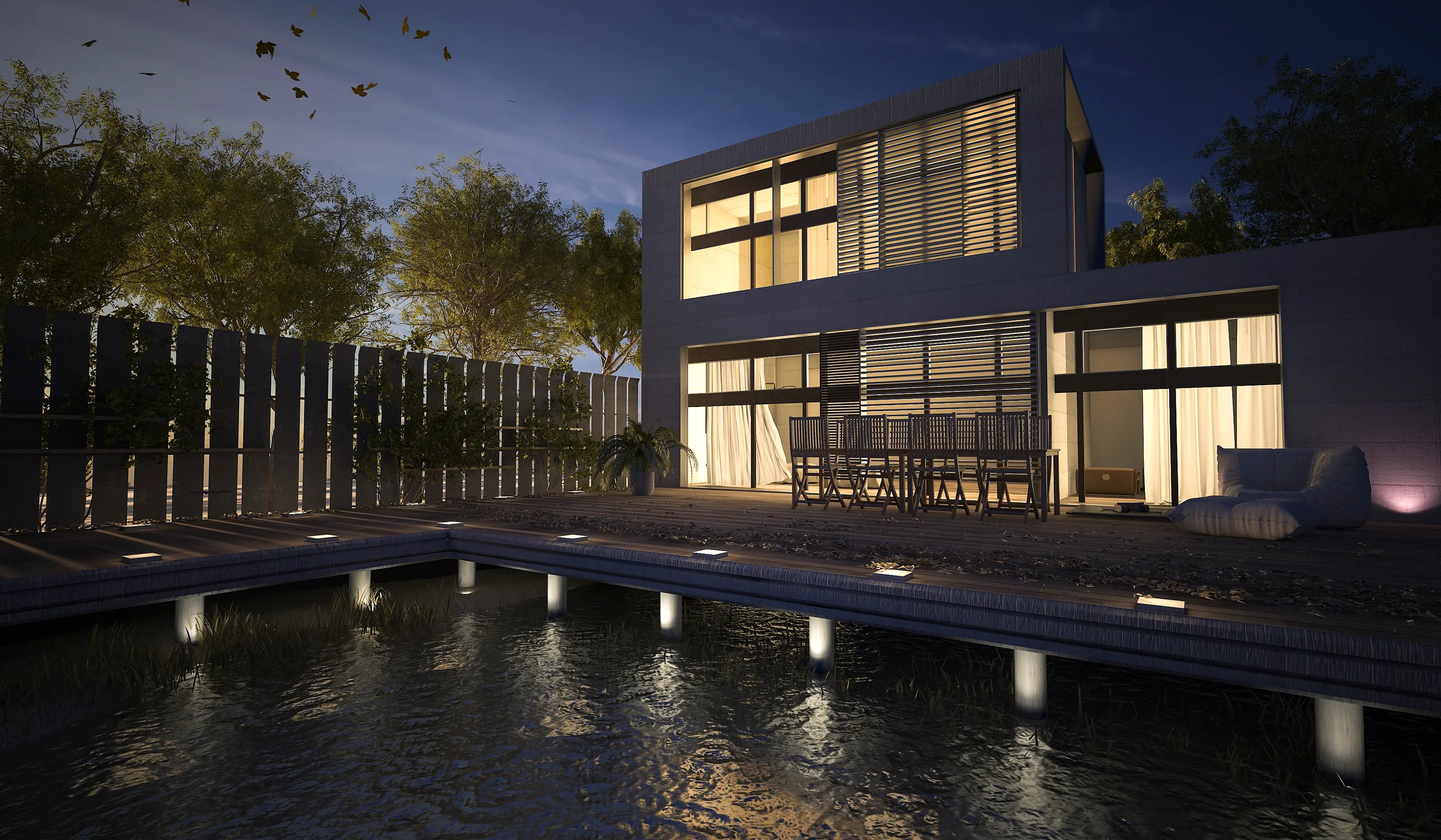 Moderne Villa mit beleuchtetem Pool bei Nacht